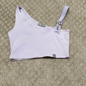 Very soft texture, has buckle on one shoulder.